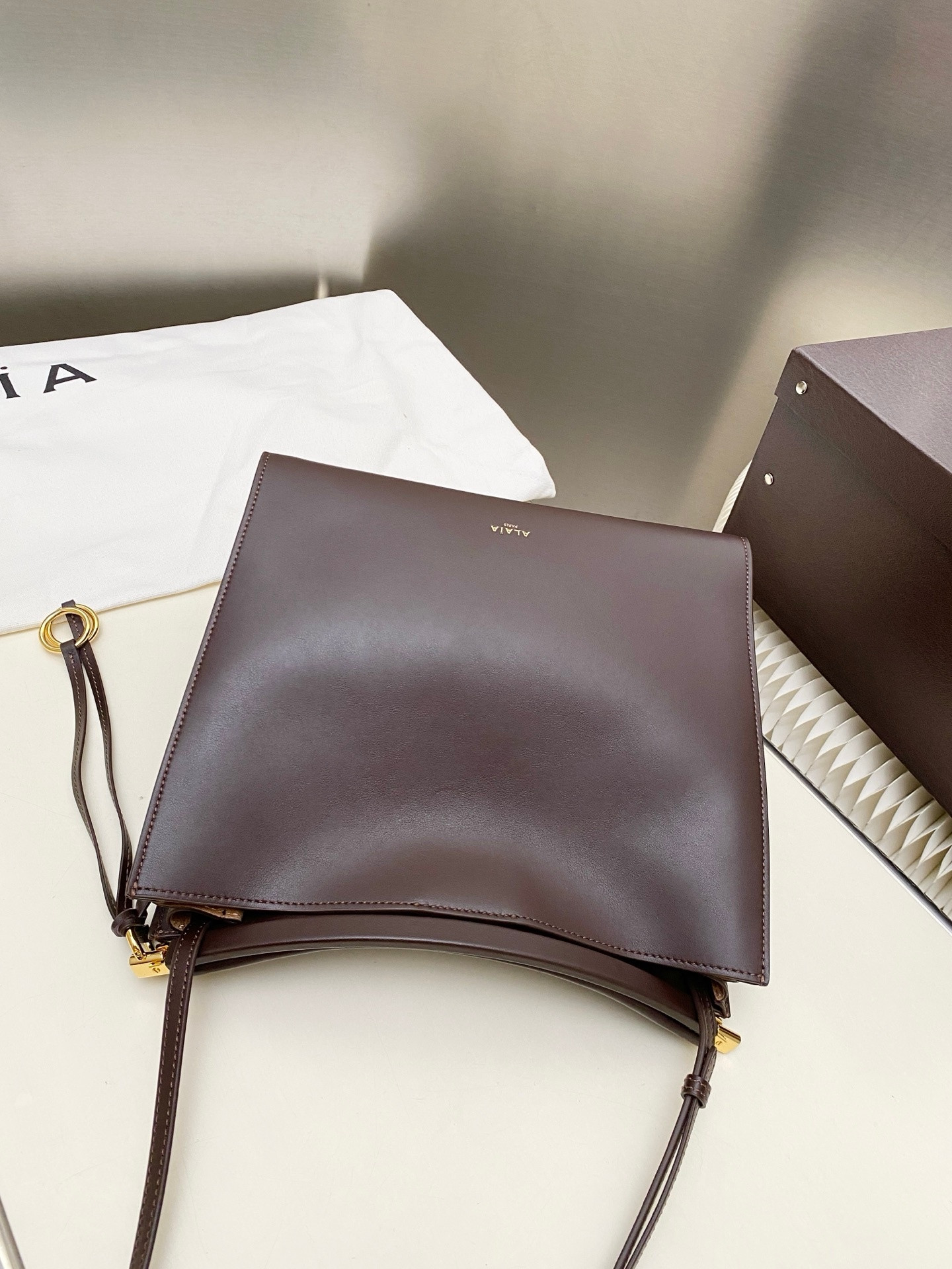 ALAÏA LE CLICK SQUARE BAG IN NUBUCK 26x14x24cm